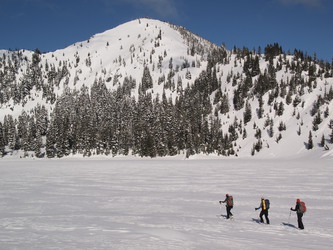 Skiing on Lake Valhalla with Mount McCausland in the background