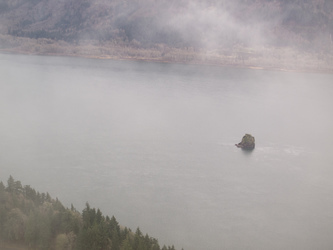 Phoca Rock and the Columbia River through the fog.