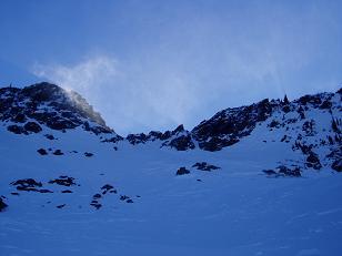 Snow blowing through the notch below the summit of Jim Hill Mountain