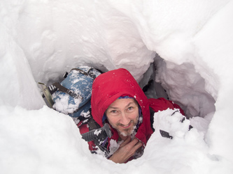 Matt broke through a hidden snow bridge and fell into a deep hole between two boulders.