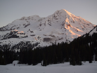 Sunrise on Mount Rainier.  The Indian Henry patrol cabin is in the lower left.