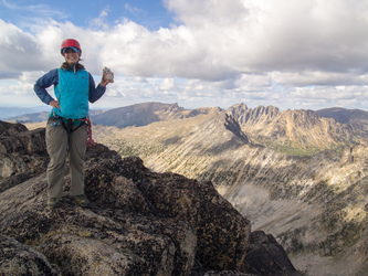 Lindsay and Mukmuk on the summit of Cathedral Peak.  In the background are The Deacon, Grimface Mountain, and Matriarch Mountain.